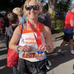 Annie proudly showing off her medal after the run