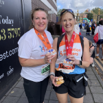 Helen and Annie showing off their completion medals post run